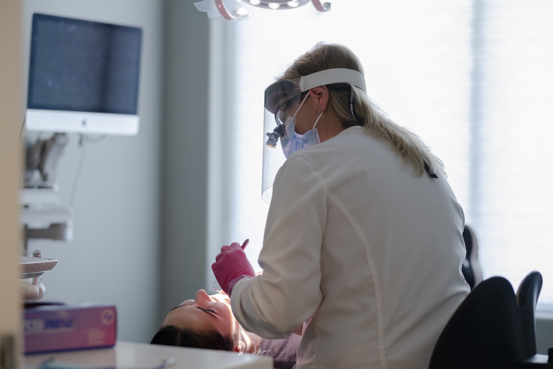 Dentist working on patient