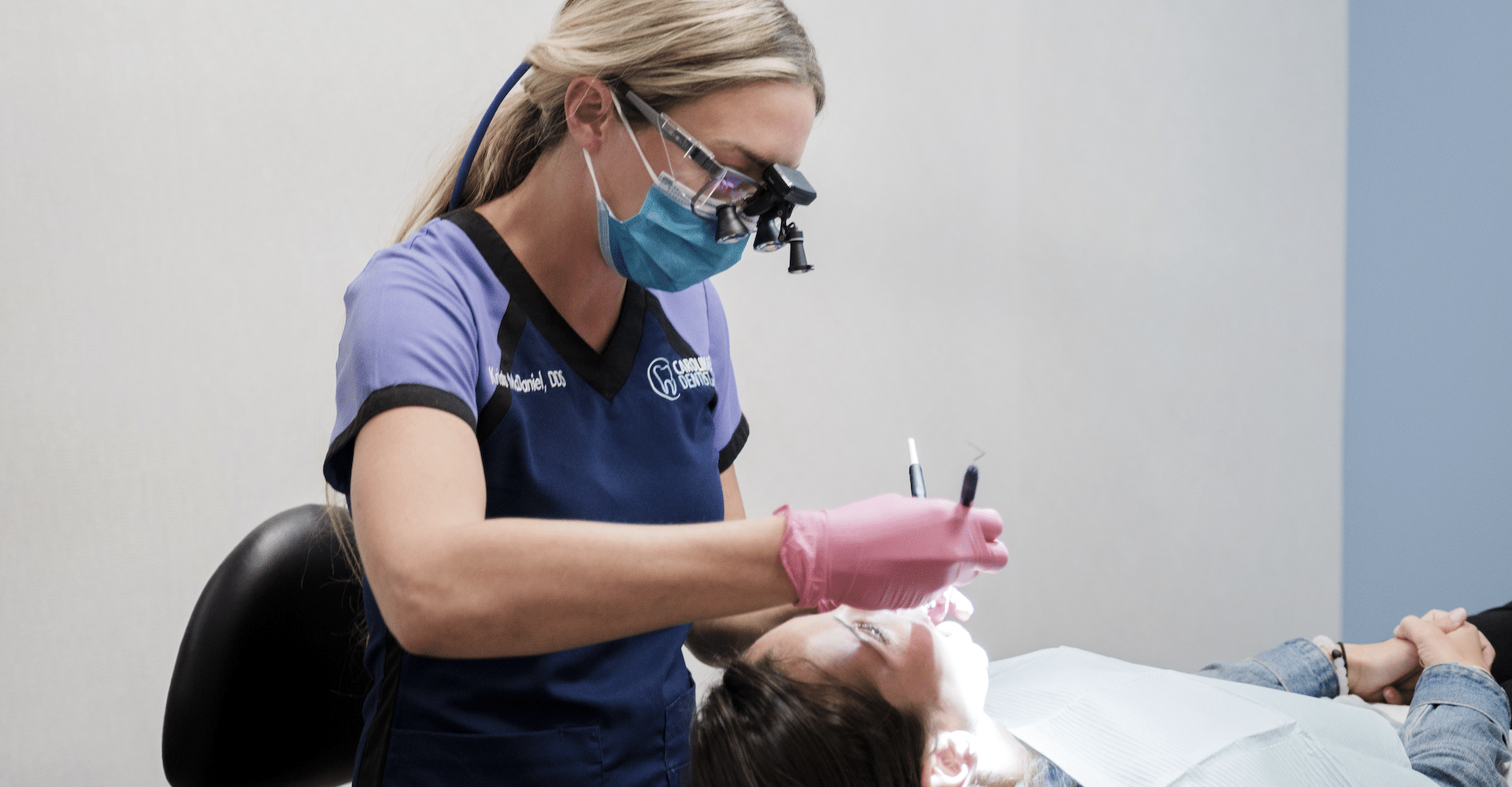 Dentist working on patient in chair