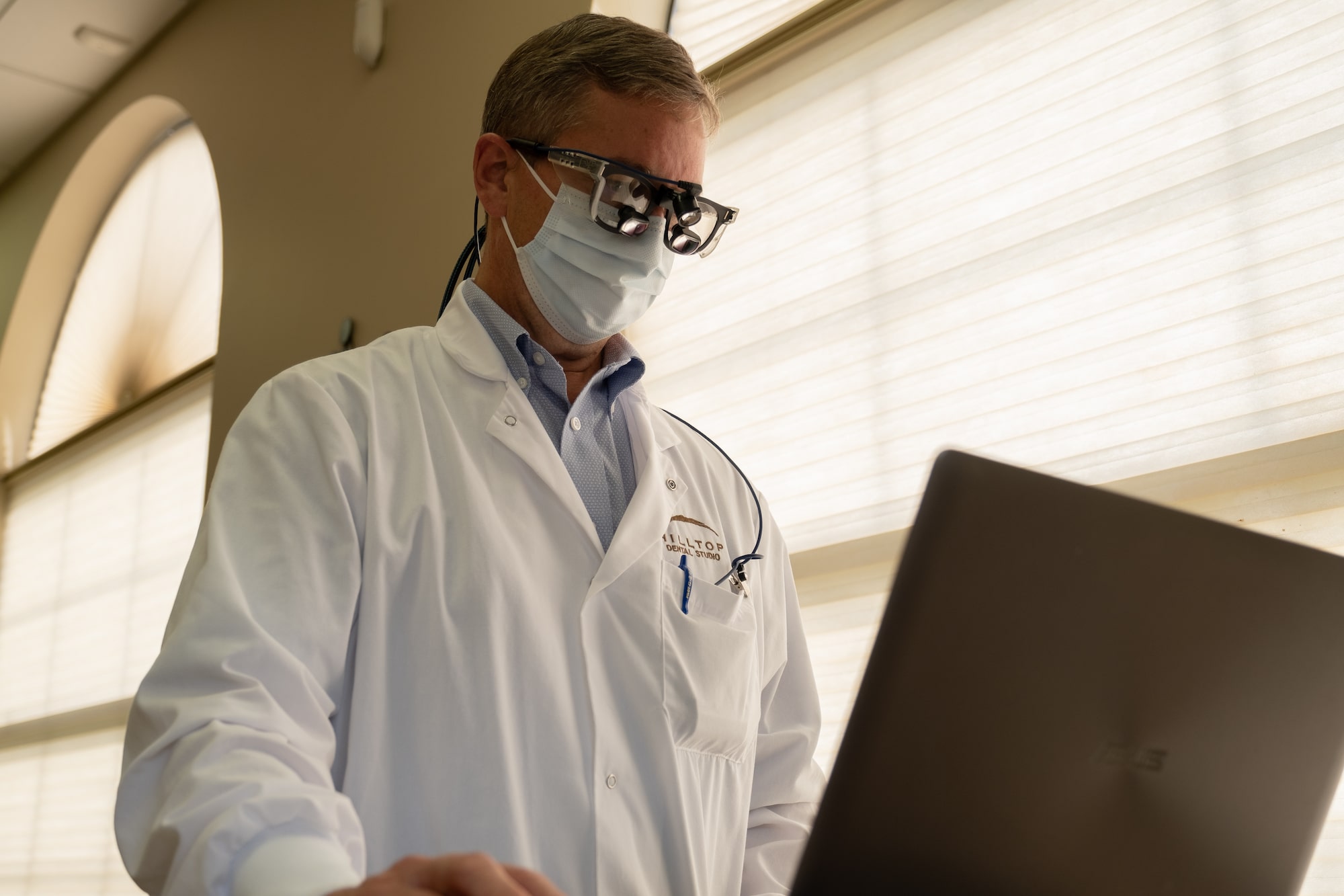 Dentist at computer