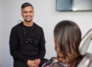 dental professional talking with a patient