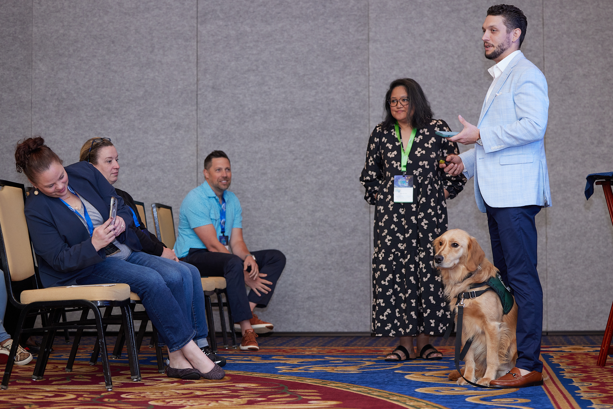 A speaker at LWD conference with a dog