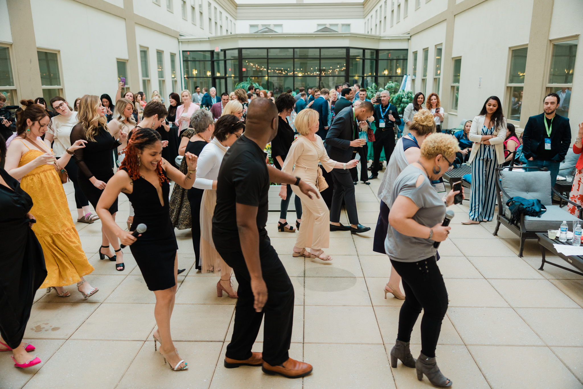 A group of individual dancing at a corporate event