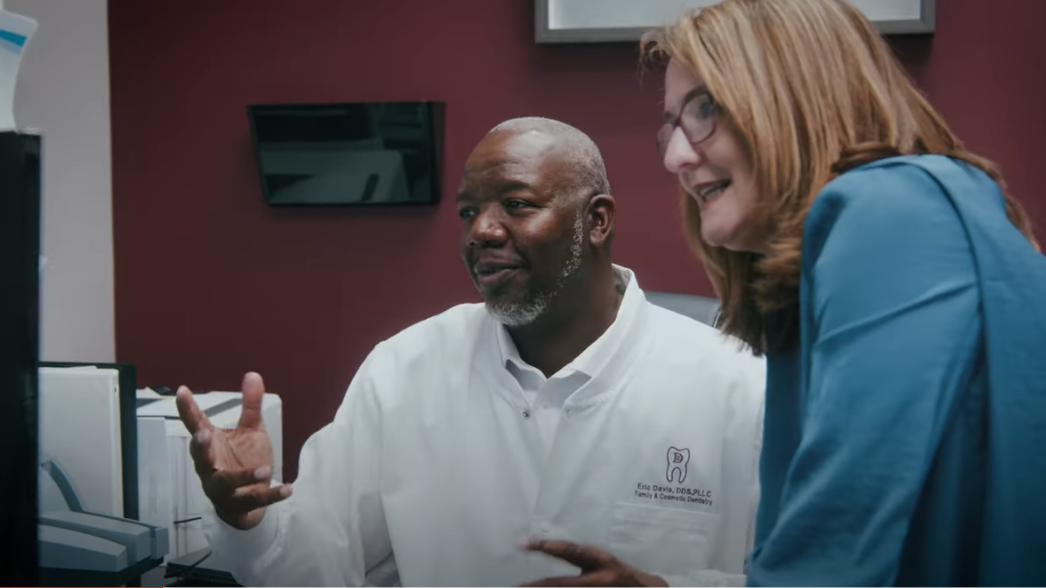 Doctor and nurse looking at computer screen