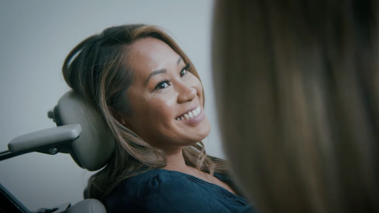 Woman in dental chair smiling