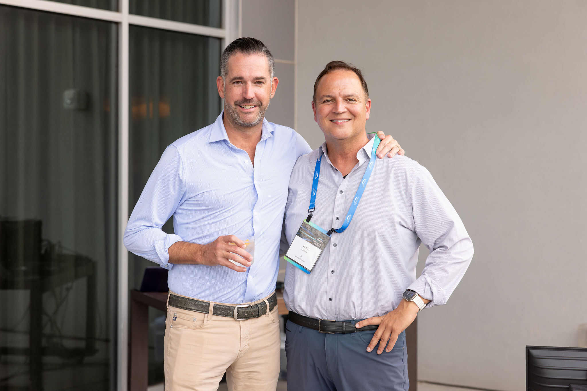 Dr. Clifton Cameron taking a photo with a colleague at a networking event